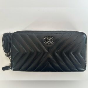 Chanel Black Calfskin Zippy Wallet with Iconic Tassel Detail & Gunmetal Hardware